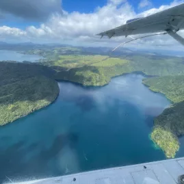 Aerial view over Lake Ōkataina seen from a Volcanic Air floatplane window
