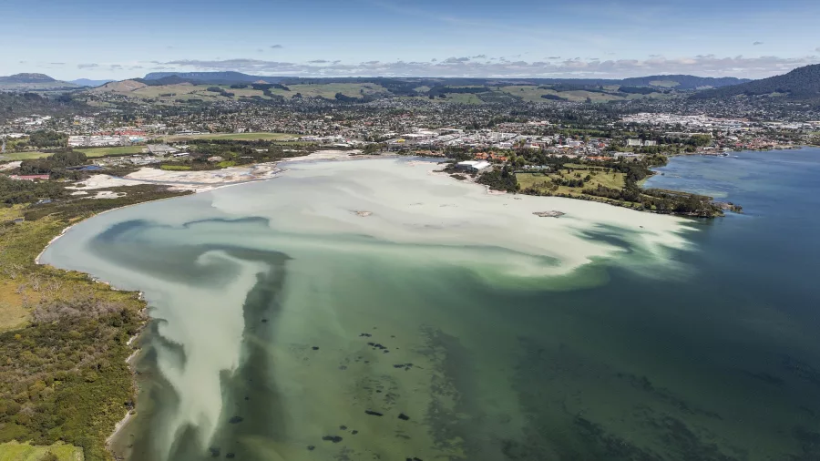 Aerial view of Sulphur Bay and Rotorua Lakefront with geothermal waters and cityscape in the background