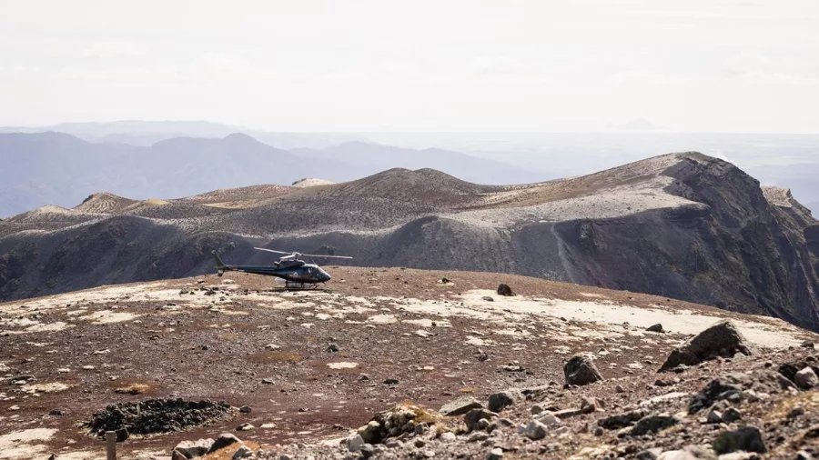 Helicopter landed on the crater rim of Mount Tarawera