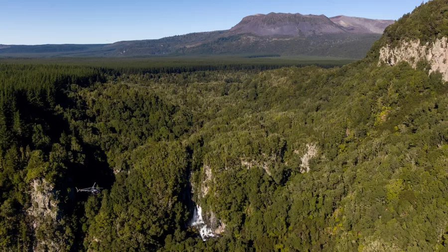 Helicopter flying over Tarawera Falls near Mount Tarawera