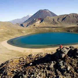 View of Blue Lake with Mount Ngauruhoe and surrounding volcanic peaks in the background