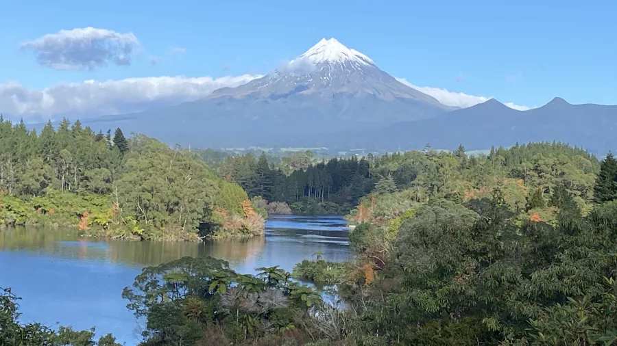 Reflections of Mount Taranaki on the surface of Lake Mangamahoe near New Plymouth