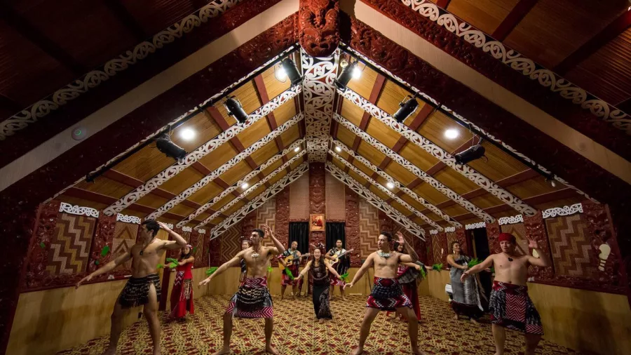 Māori performers at Te Puia in traditional dress presenting a haka during a cultural performance in Rotorua