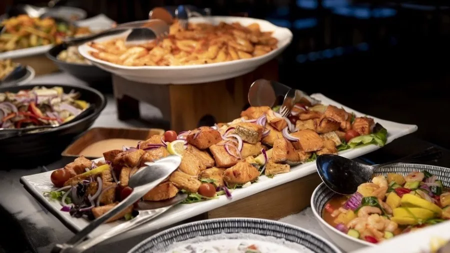 Hot dishes and meats from a traditional Māori hāngi buffet at Te Puia, Rotorua