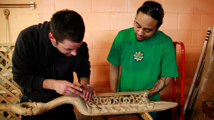 Māori guides sharing cultural knowledge during a traditional experience at Te Puia, Rotorua