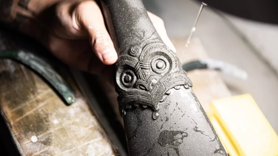 Close-up of a traditional Māori stone carving in progress at Te Tekapu carving school, Rotorua