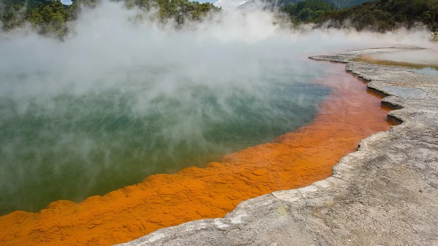 Wide view of Champagne Pool with thick steam and colourful mineral formations at Wai-O-Tapu near Rotorua