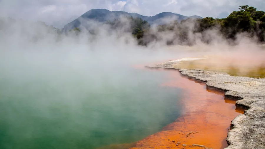 Colourful edge of Champagne Pool with steam rising at Waiotapu Thermal Wonderland, Rotorua
