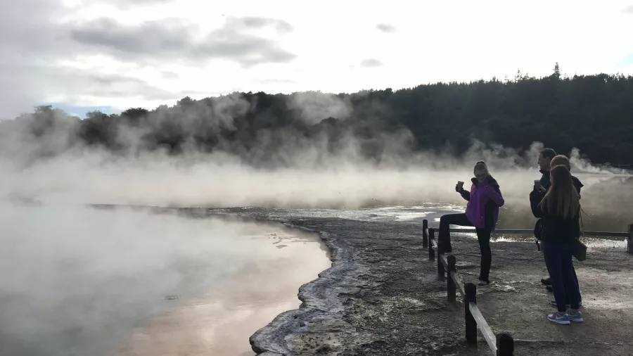 Champagne Pool at Wai-O-Tapu with steaming turquoise water, orange silica edge, and sulphur-rich geothermal landscape