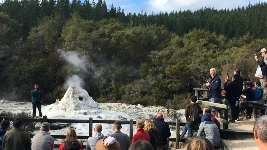 Crowd gathered around Lady Knox Geyser moments before eruption at Wai-O-Tapu