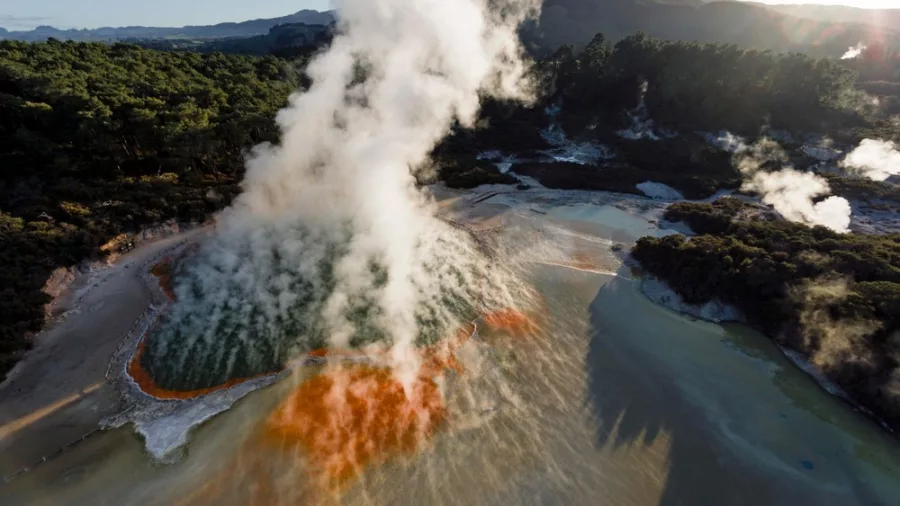 Aerial view of Champagne Pool with vibrant orange and green geothermal hues at Wai-O-Tapu