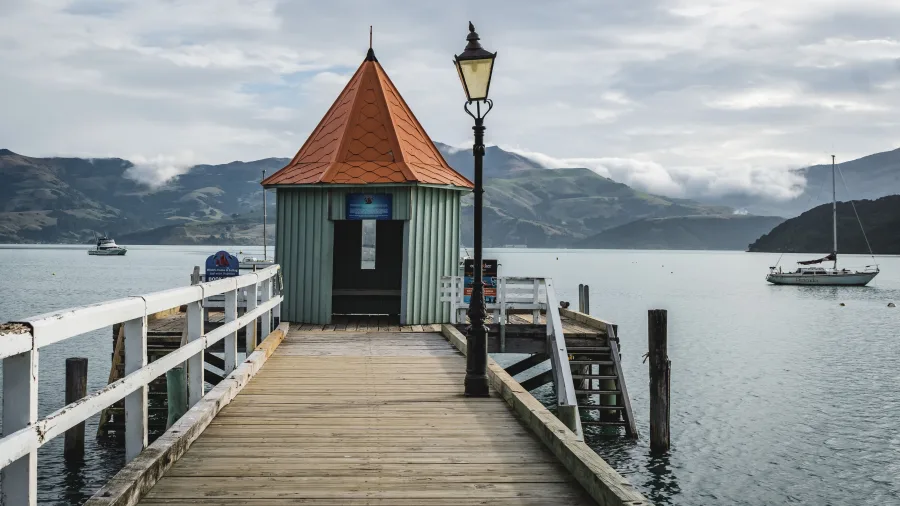 Daly’s Wharf extending into Akaroa Harbour, Canterbury, New Zealand
