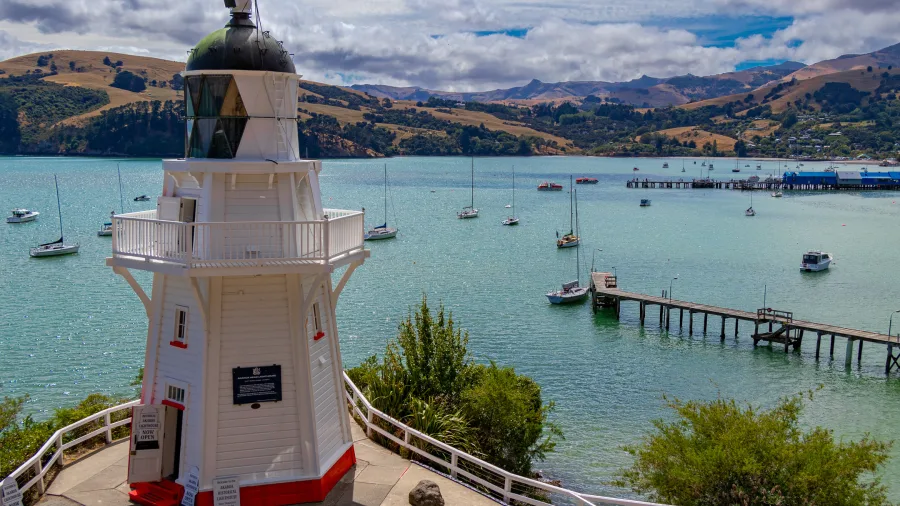 View of Akaroa Lighthouse overlooking the harbour and boats, Canterbury