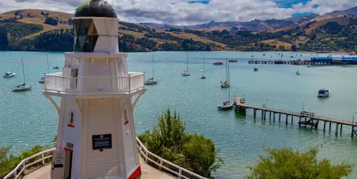 View of Akaroa Lighthouse overlooking the harbour and boats, Canterbury