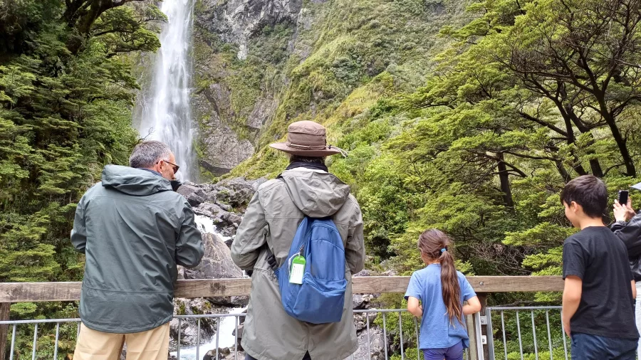 Visitors at Devils Punchbowl Waterfall lookout in Arthur’s Pass National Park