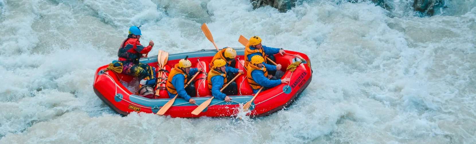 White-water rafting crew tackling rapids on the Rangitata River in Ashburton District
