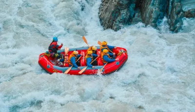 White-water rafting crew tackling rapids on the Rangitata River in Ashburton District