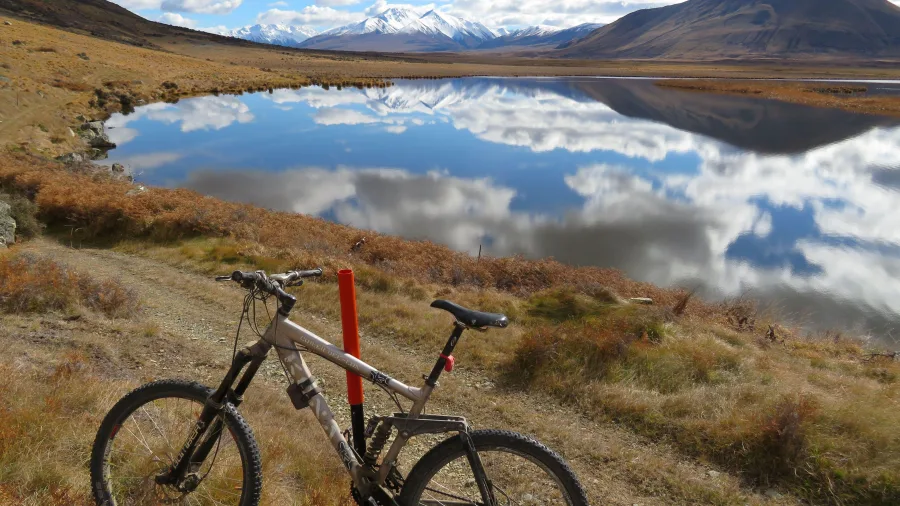 Mountain bike parked by Lake Emma in the Ashburton Lakes region, New Zealand