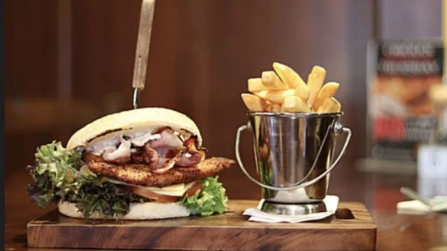 Gourmet burger with fries served at Armadillos Restaurant in Ashburton, New Zealand