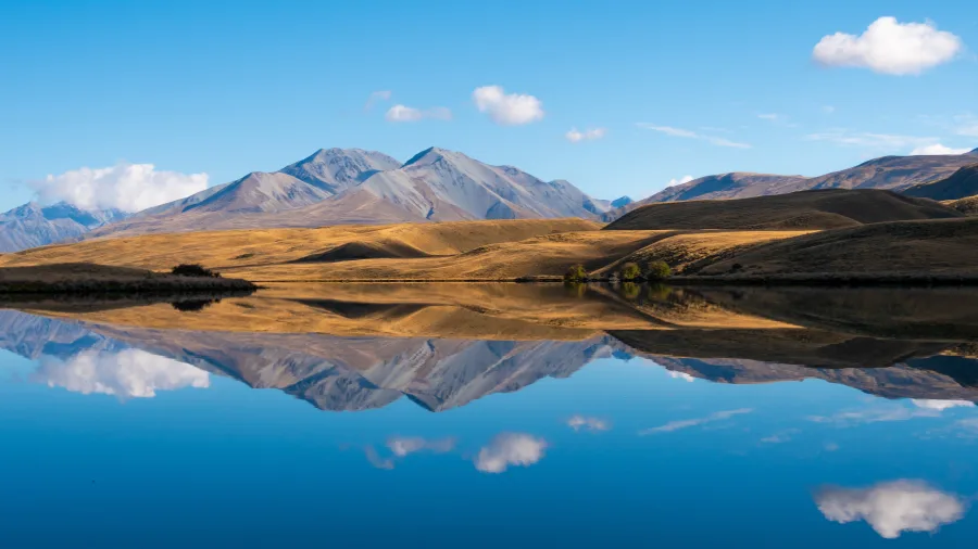Reflection of mountains in the calm waters of Lake Clearwater, Ashburton Lakes, New Zealand