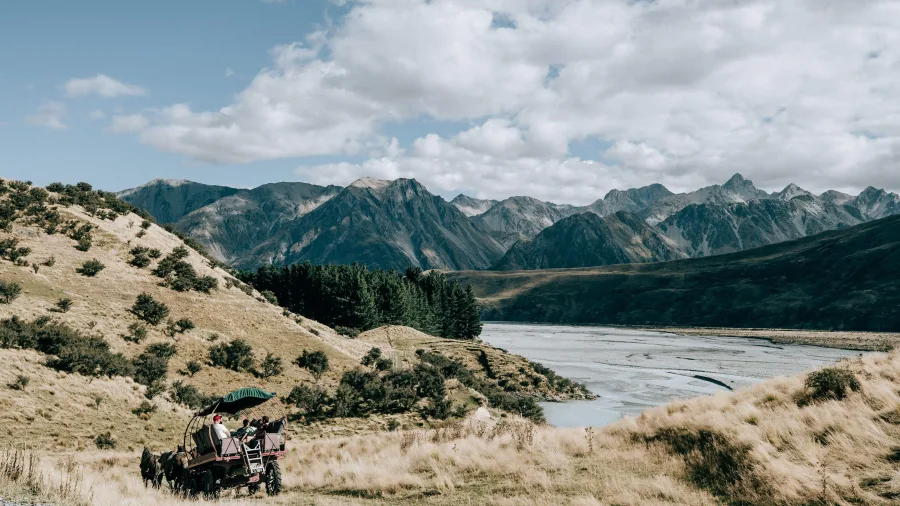 Horse-drawn carriage touring the landscapes of Erewhon Station in Canterbury, New Zealand