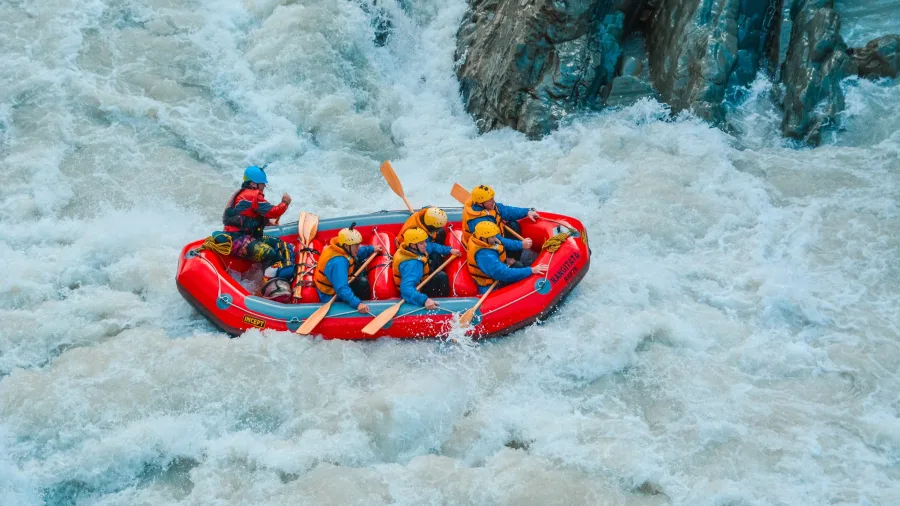 White-water rafting crew tackling rapids on the Rangitata River in Ashburton District