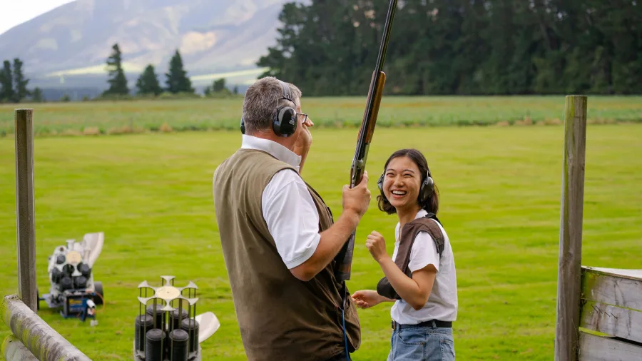 Woman enjoying clay target shooting at NewZengland near Methven