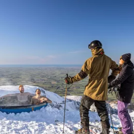 Skiers relaxing in mountain hot tub at Mt Hutt