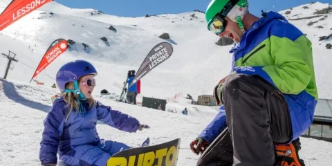 Child learning to snowboard at Mt Hutt ski field