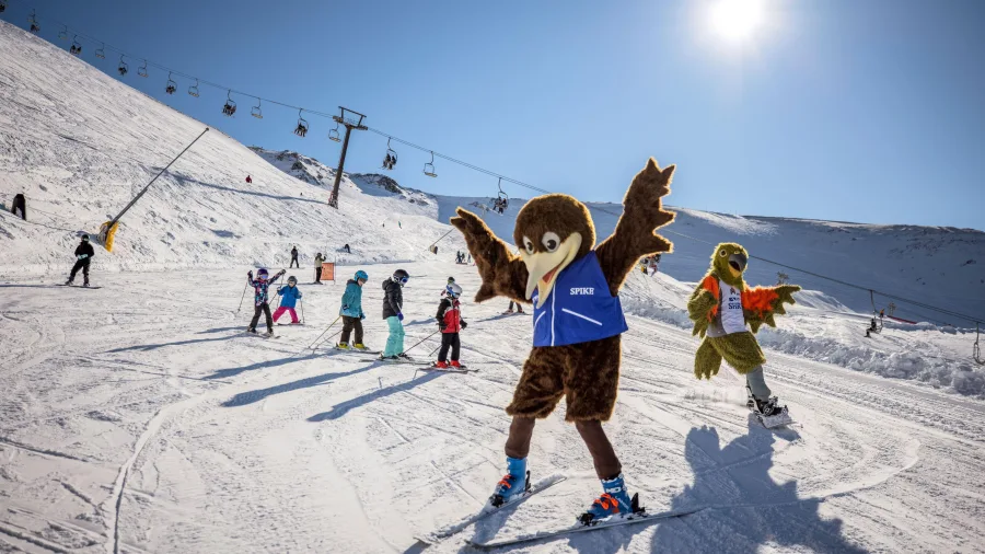Ski mascots entertaining children on Mt Hutt slopes