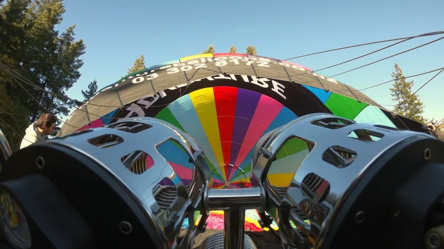 Close-up view from behind the burners during hot air balloon inflation in Canterbury