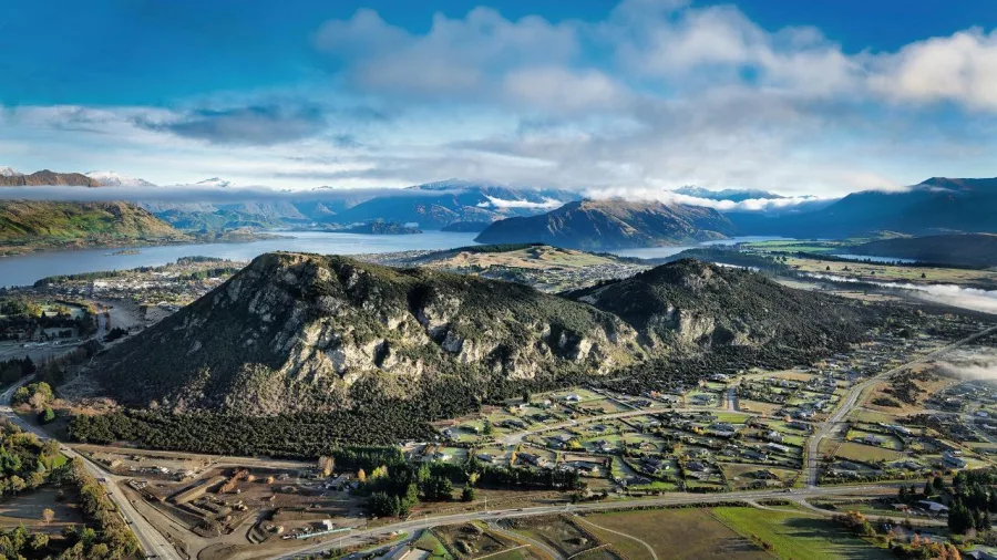 Aerial view of Wanaka town, lake, and mountains from hot air balloon