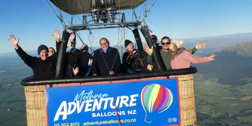 Group enjoying hot air balloon ride over Wanaka with Adventure Balloons NZ