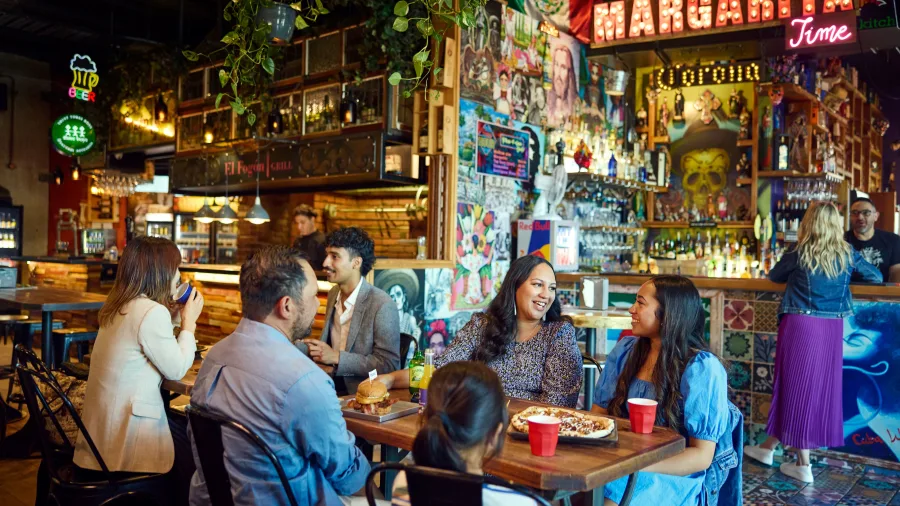 Friends enjoying food at Little High Eatery in Christchurch