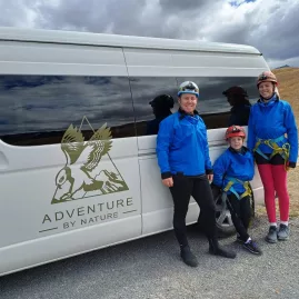 Adventure By Nature tour group beside van at Castle Hill