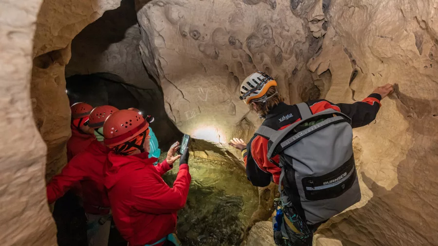 Tour group receiving a safety briefing near the Cave Stream entrance in Canterbury