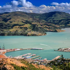 Panoramic view of Lyttelton Harbour from above with the port and hills in the background