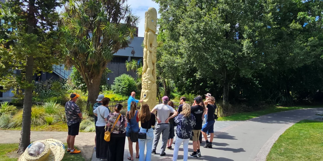 Group visiting the Pou Pou Monument in Victoria Square, Christchurch