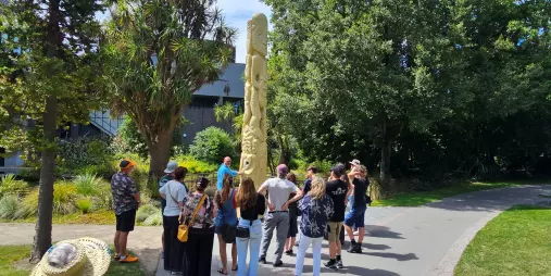 Group visiting the Pou Pou Monument in Victoria Square, Christchurch