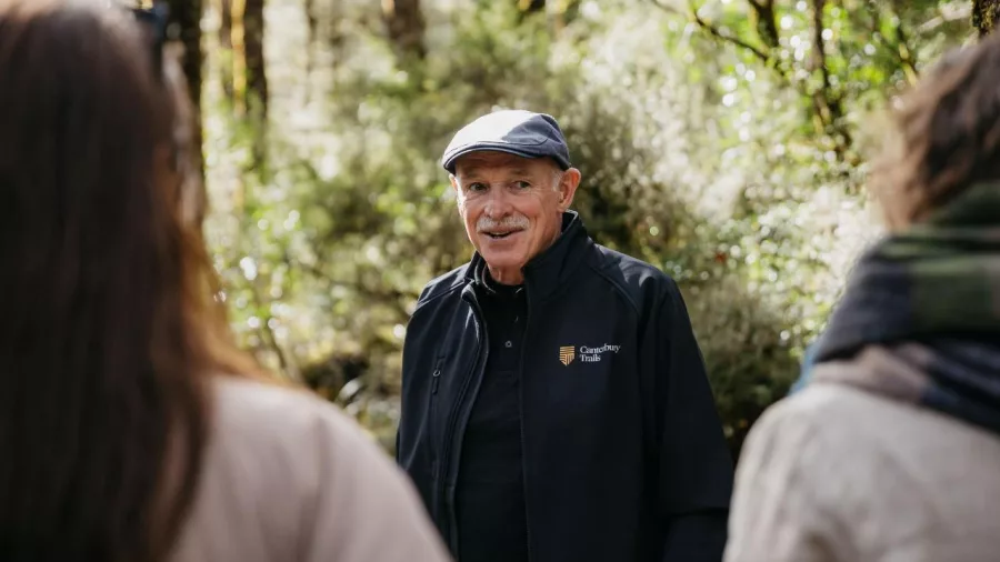 Tour guide sharing insights during a nature walk in Arthur’s Pass National Park