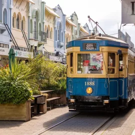 Vintage Christchurch tram on colourful New Regent Street with cafés and shops