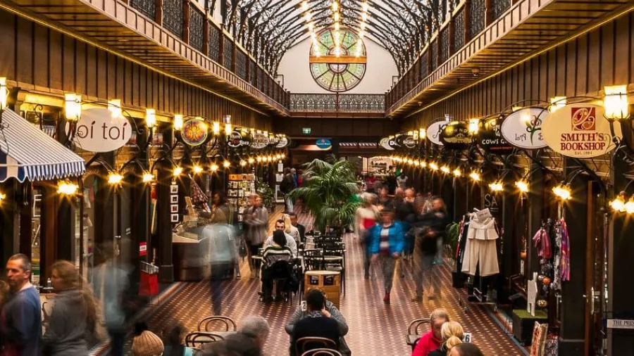 Interior of The Tannery shopping arcade in Christchurch with people dining and browsing boutique stores