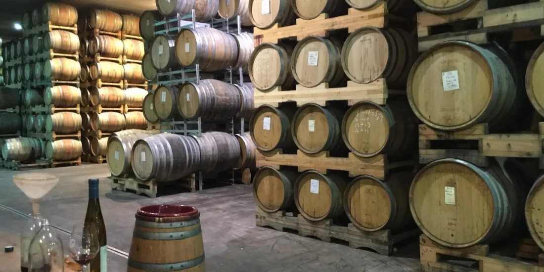 Wine barrels stacked at Pegasus Bay Winery in Waipara.