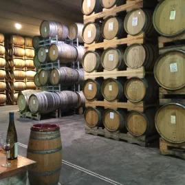 Wine barrels stacked at Pegasus Bay Winery in Waipara.