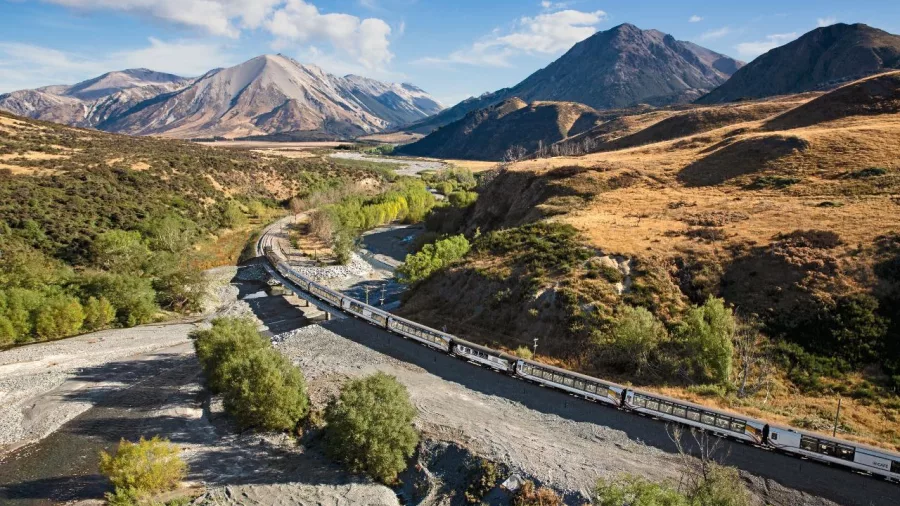 The TranzAlpine train curves through the Craigieburn Ranges in Canterbury.