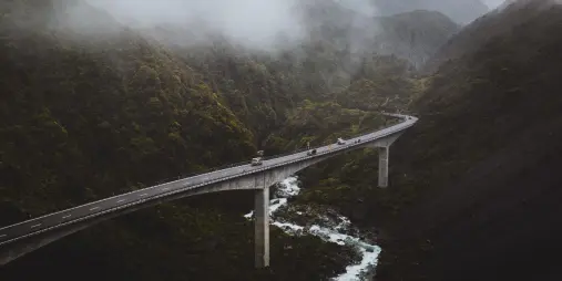 The Otira Viaduct stretching across a misty mountain valley in Arthur’s Pass