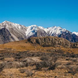 Wide valley of the Rangitata River leading to snow-dusted Southern Alps, New Zealand