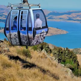 Gondola cabin overlooking Banks Peninsula and the turquoise waters of Lyttelton Harbour