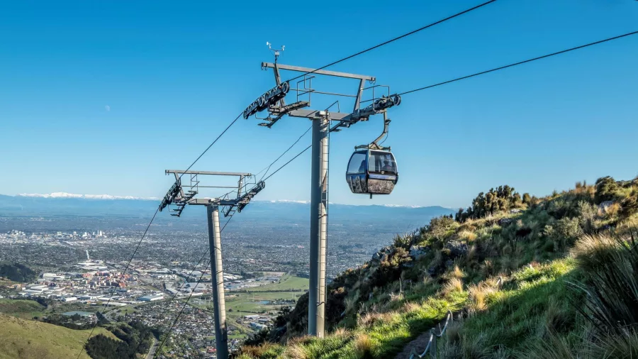 Gondola descending from Port Hills with Christchurch city visible in the distance