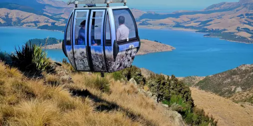 Gondola cabin overlooking Banks Peninsula and the turquoise waters of Lyttelton Harbour